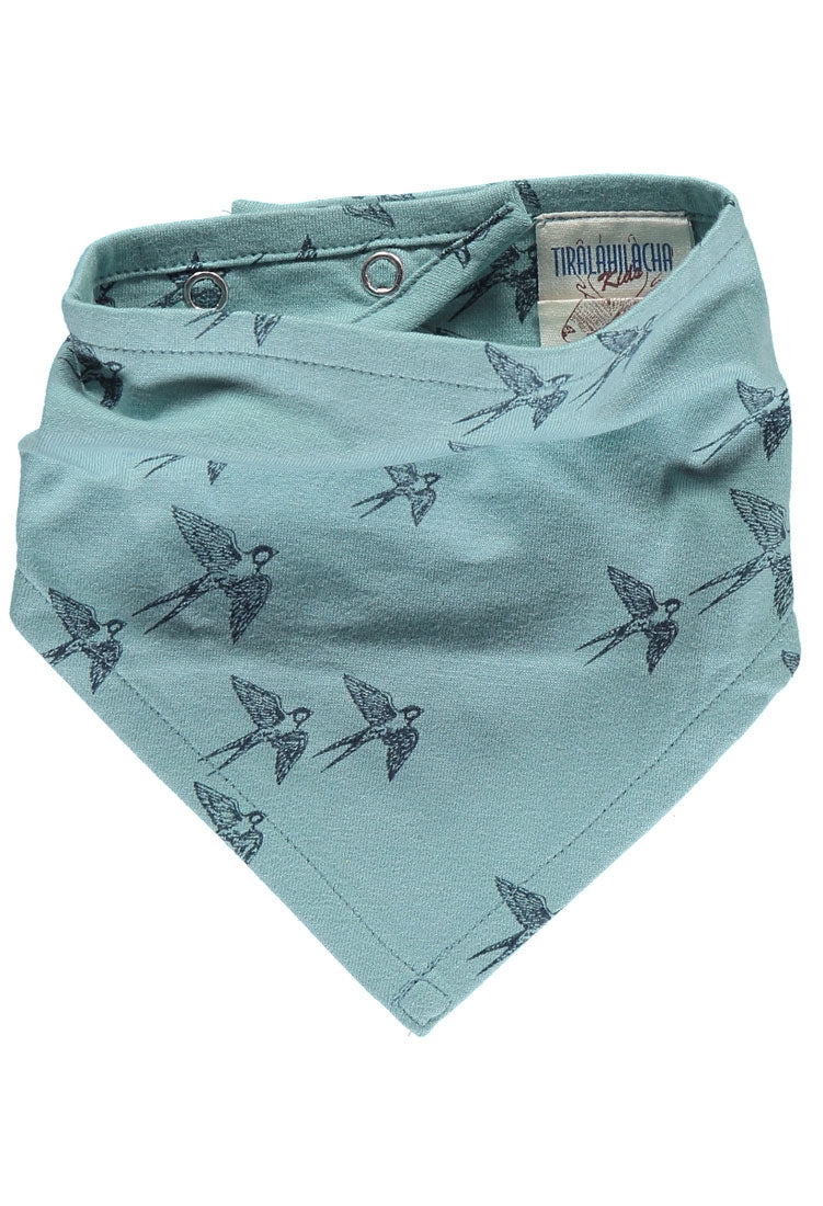 Babero reversible azul con estampado golondrinas