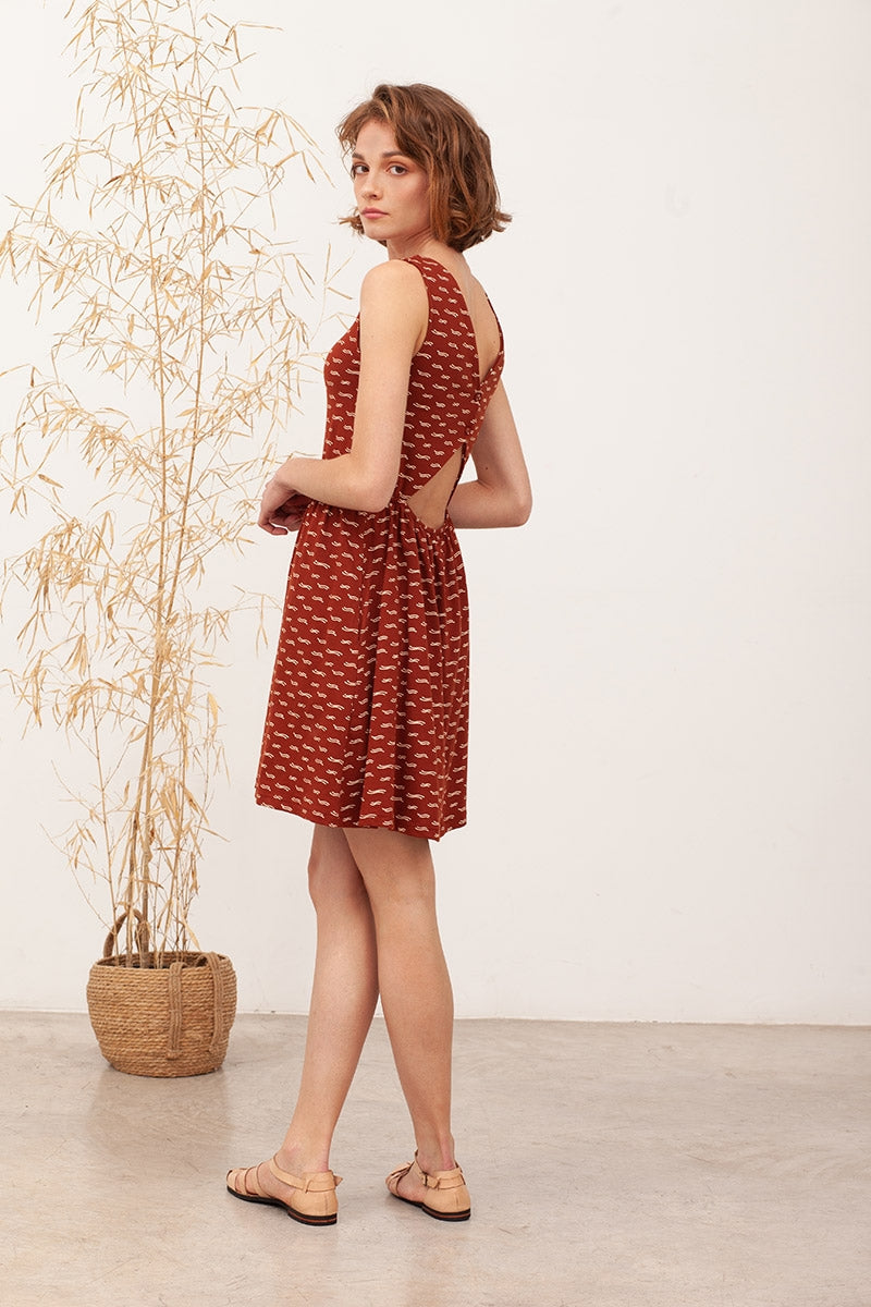 BELISA's backless dress in terracotta