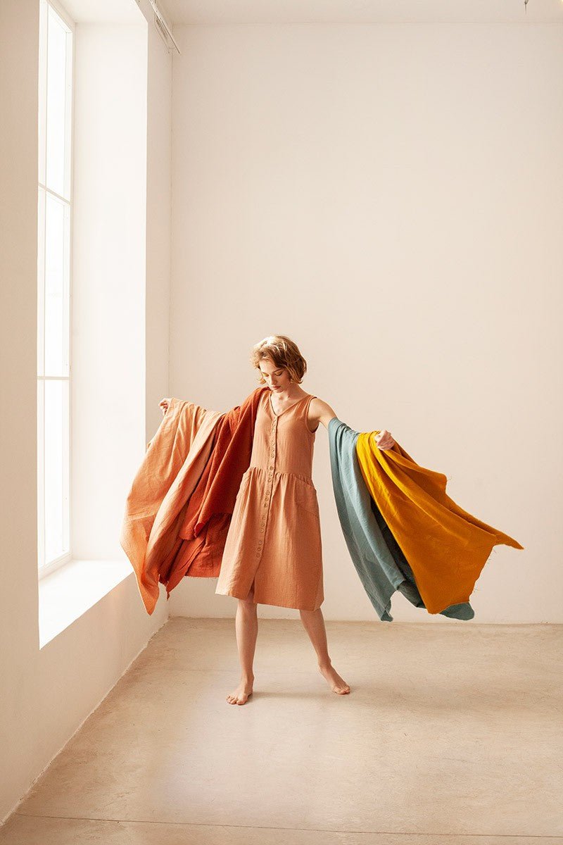 BRUNELLA V-neck muslin dress in nude.