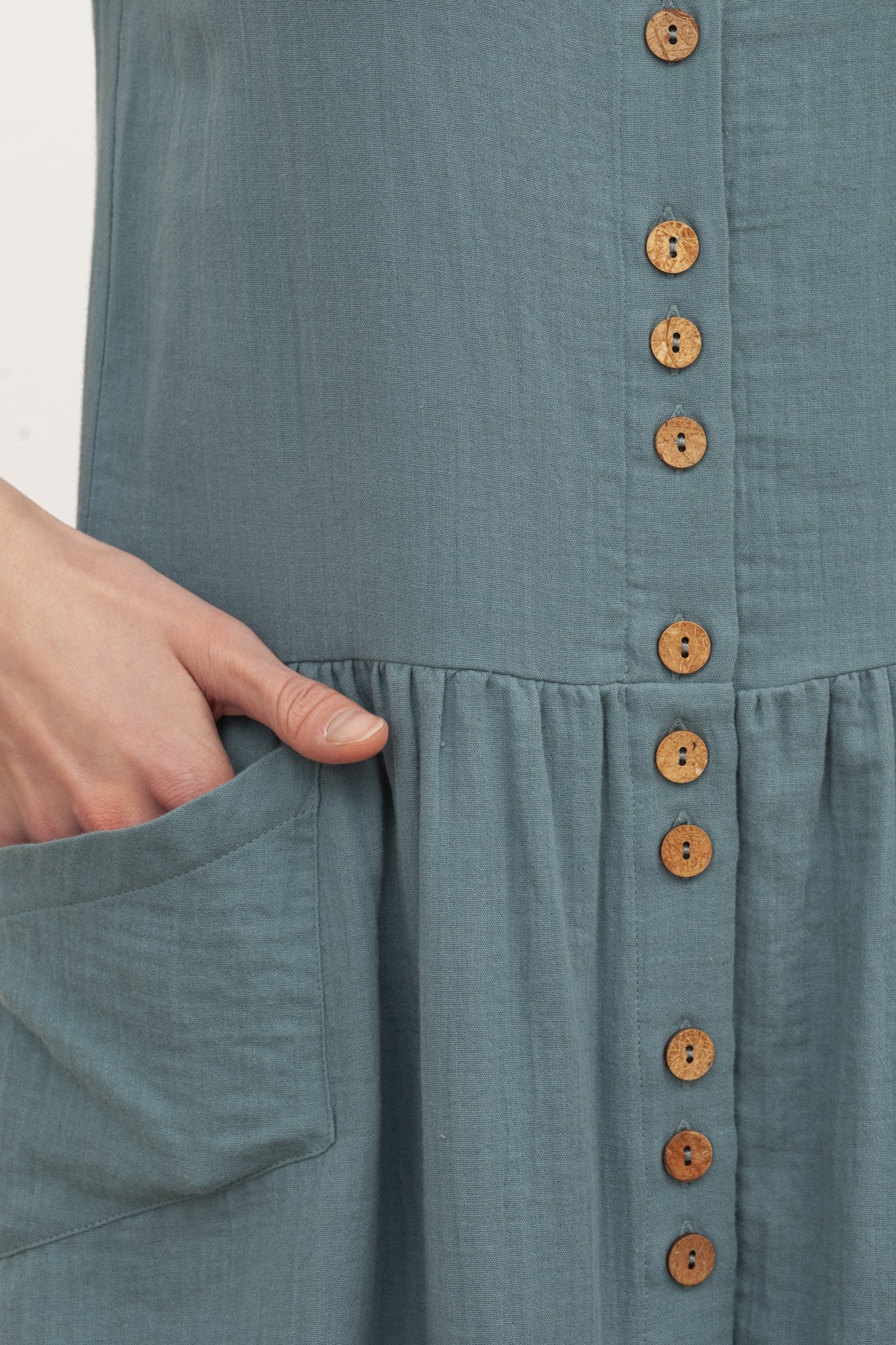 BRUNELLA's V-neck muslin dress in blue.