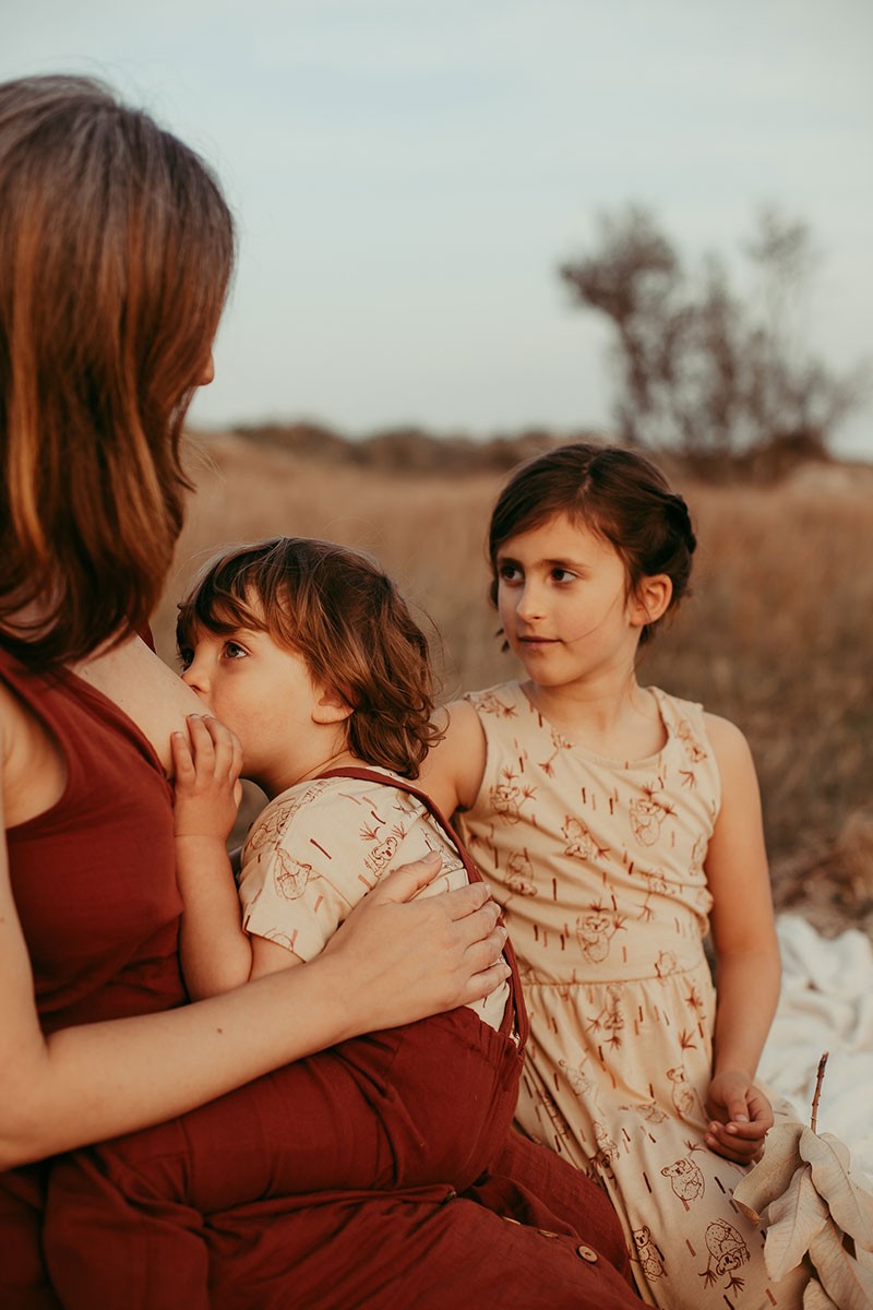 BRUNELLA's V-neck muslin dress in terracotta.