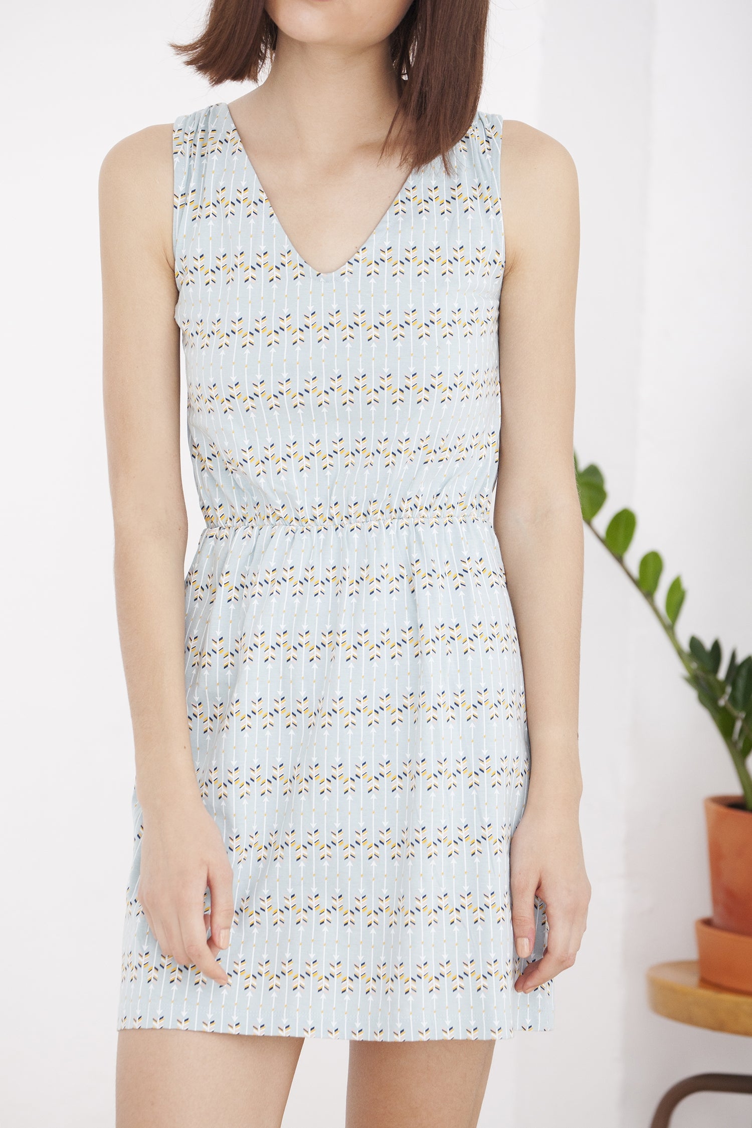 Hilla light blue arrow print open back dress