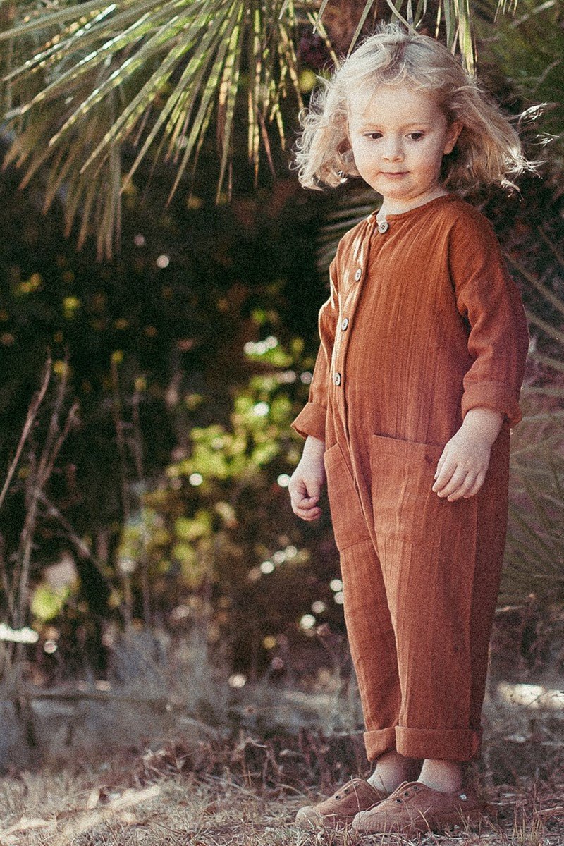 Surya unisex jumpsuit in terracotta